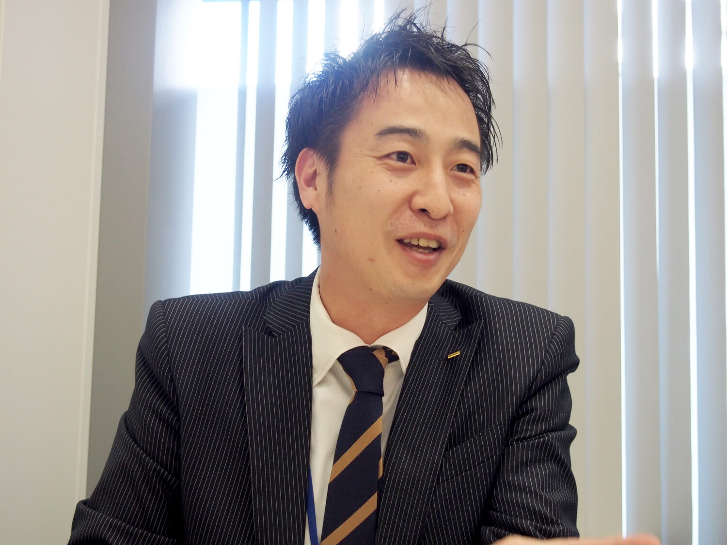 サービス強化・スタッフ育成室 マネジャー・早田貴嗣さん。2005年に入社し、エリア管轄や新規ホームの立ち上げ、有料老人ホームの事業推進に携わり、今春から人材開発を担当。